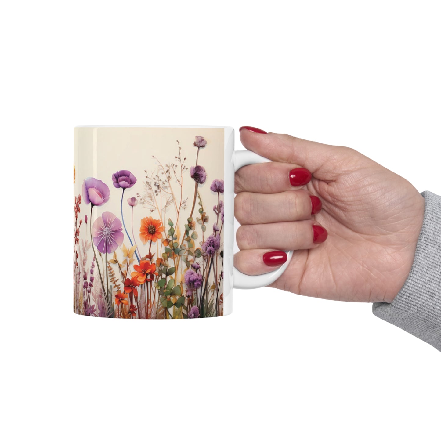 Model holding floral watercolour mug, 11oz ceramic mug with colourful floral artwork and easy-to-hold C-handle