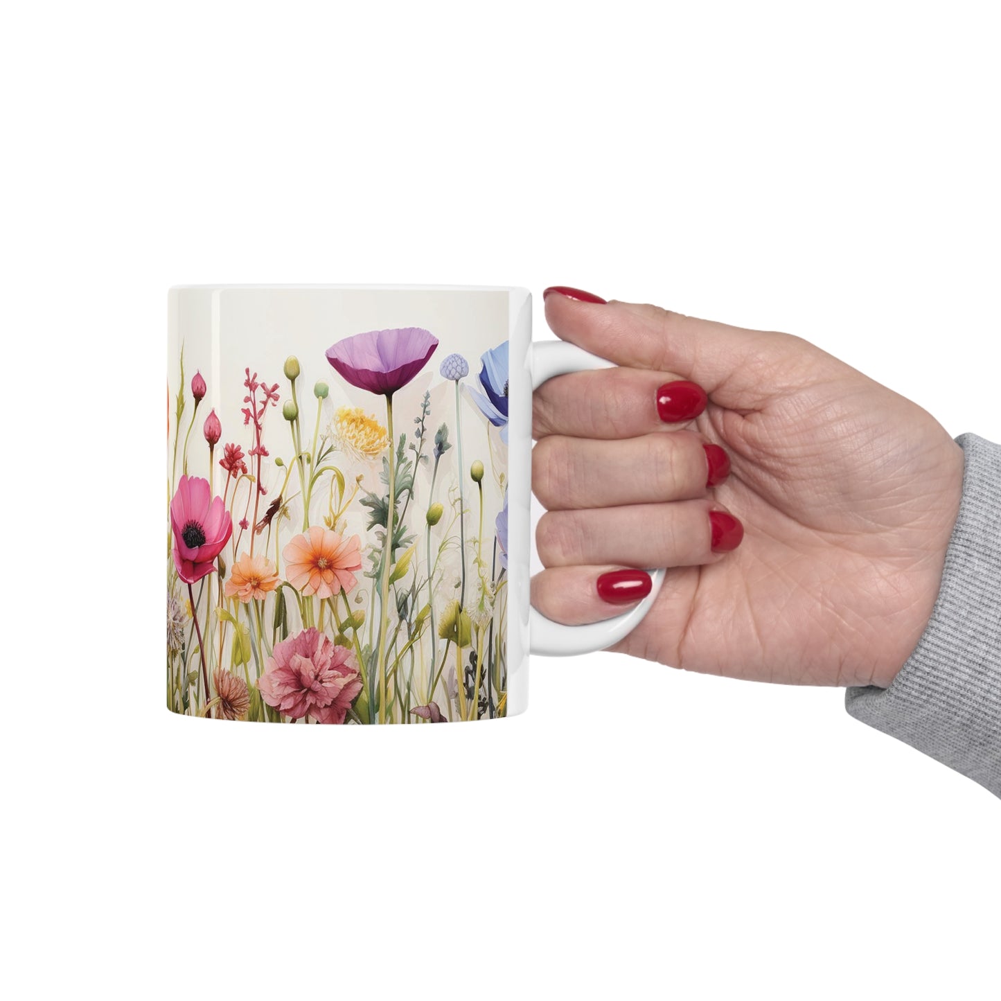 Model holding floral watercolour mug, 11oz ceramic mug with beautifully painted flowers and a functional C-handle