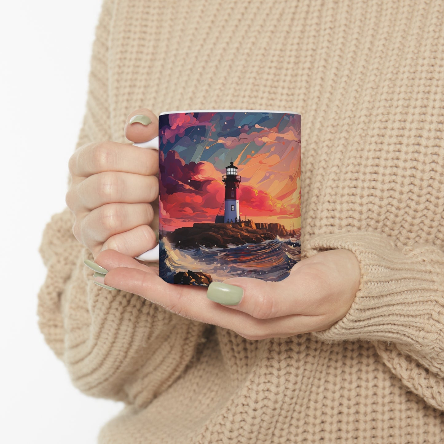 Woman holding pastel lighthouse coffee mug with watercolour coastal artwork featuring a lighthouse, sunset sky, crimson clouds, and waves.