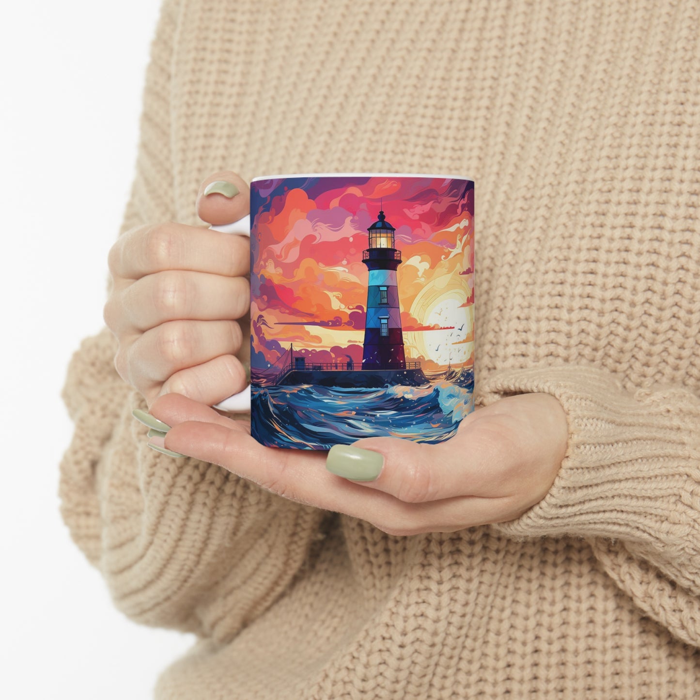 Model holding Pastel Lighthouse Mug with dramatic coastal artwork featuring a lighthouse, navy waves, glowing sun, and colourful sky.