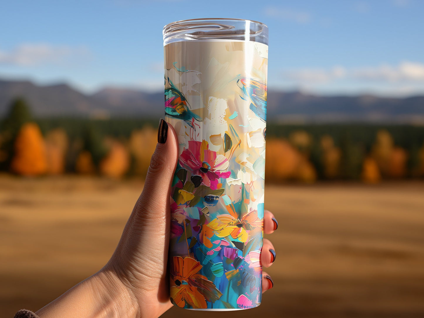 Stylish abstract butterfly tumbler in hand, featuring slim profile and durable double-walled construction