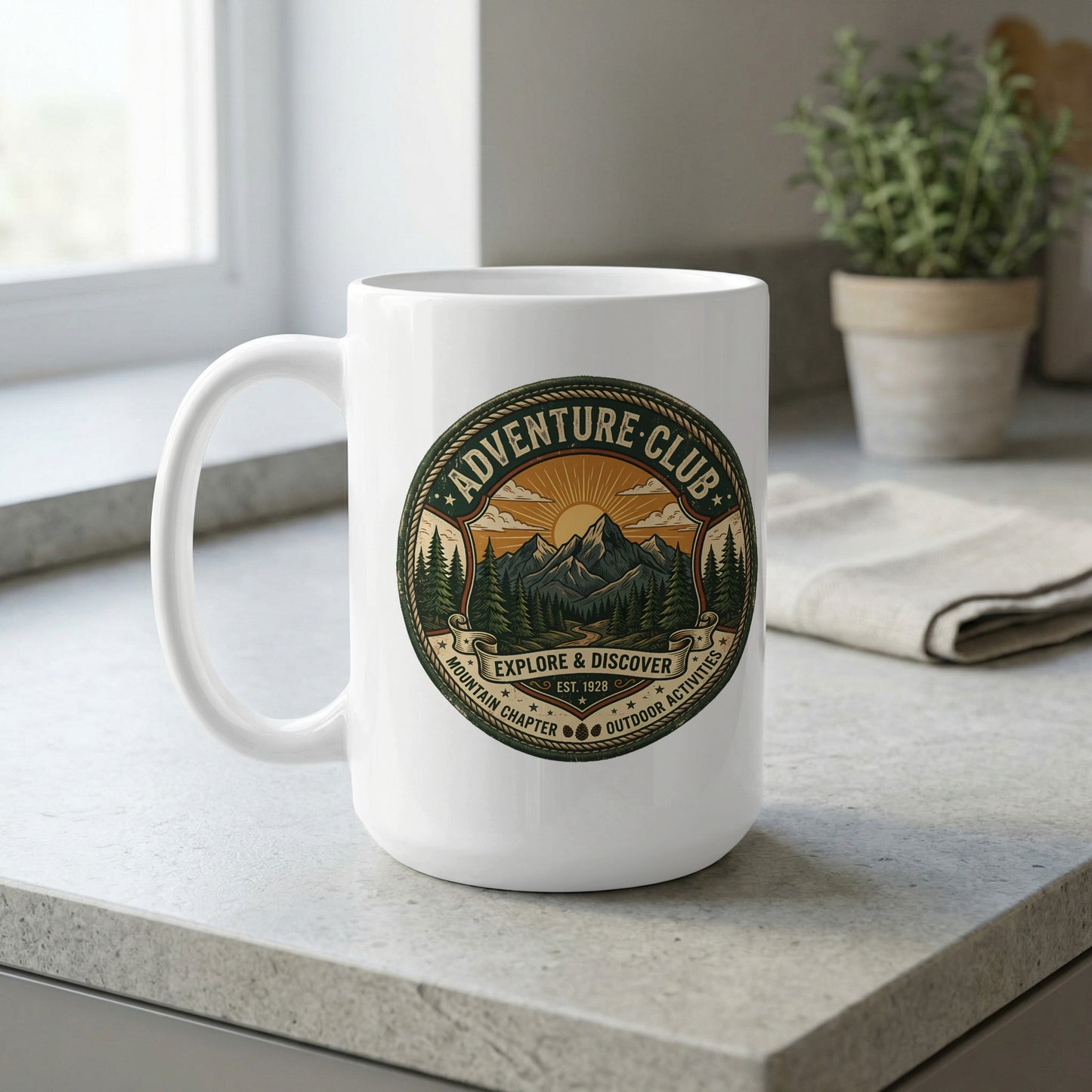 Adventure Club 15oz ceramic mug by window featuring radiant sunrise, pine forest and mountain landscape in circular design.