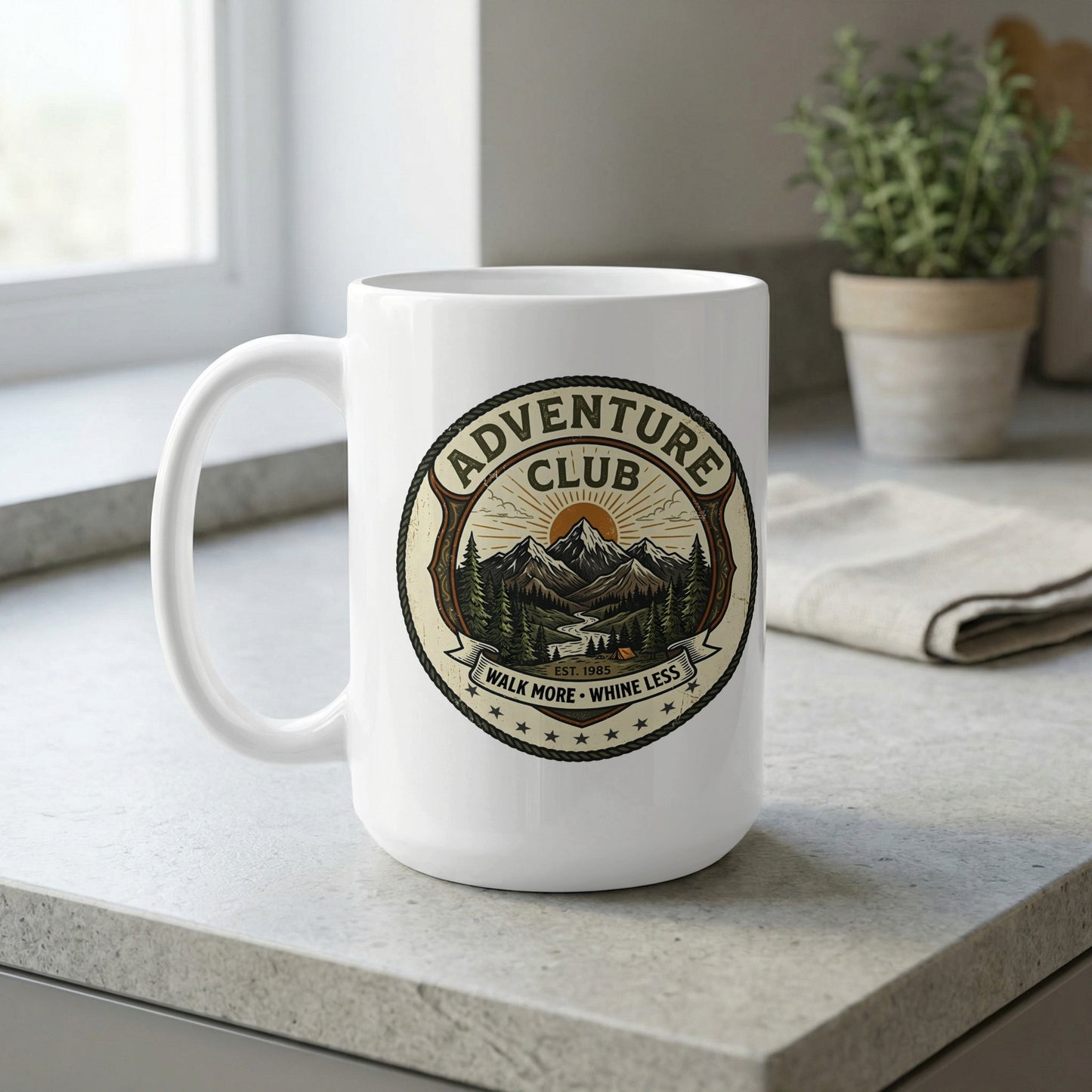 Close-up profile of the 15oz ceramic mug showing the clean white C-handle and vivid green outdoor badge print.