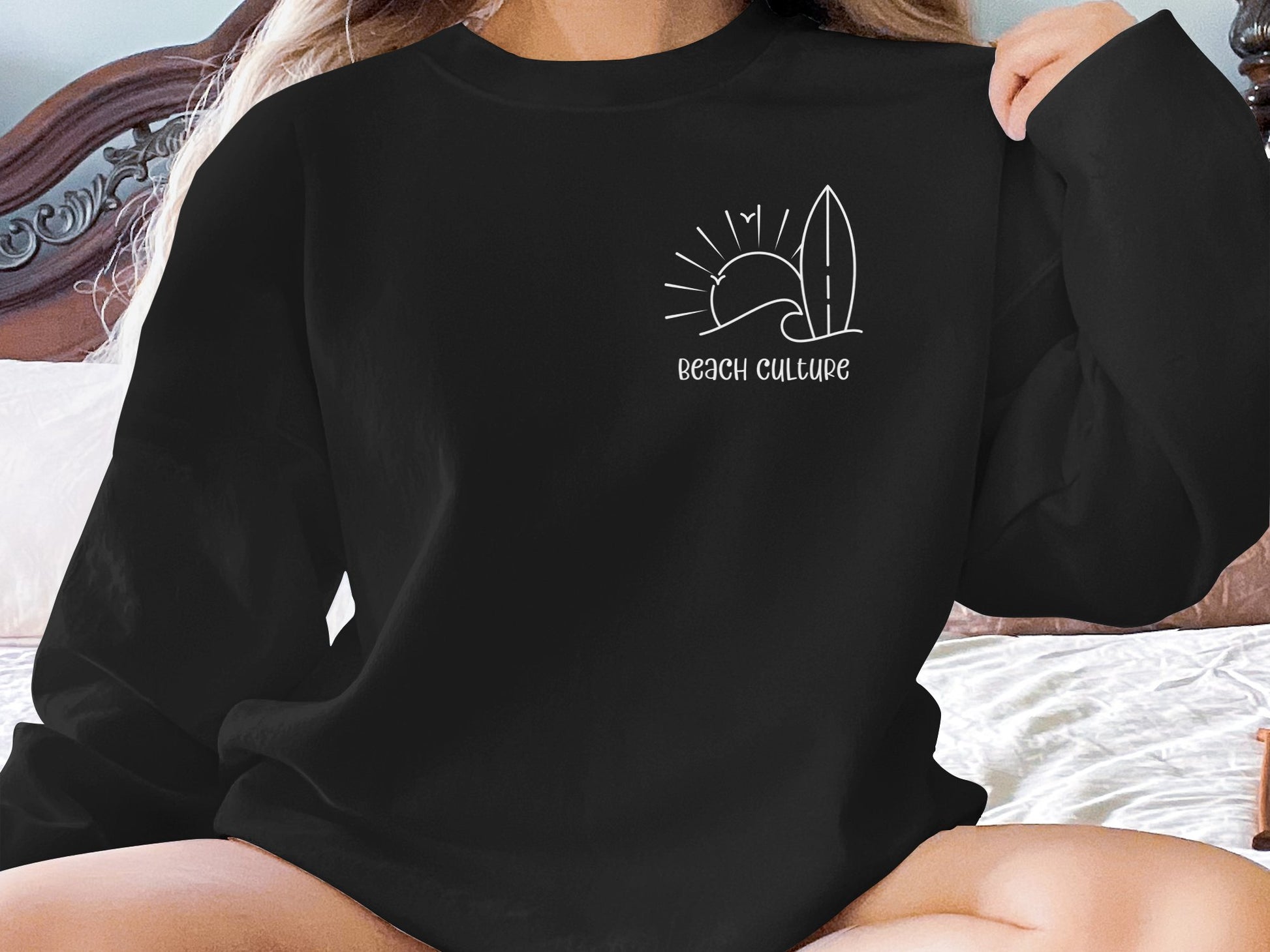 Black Beach Culture Sweatshirt with relaxed unisex fit, seamless body, cotton blend, and classic crew neckline.