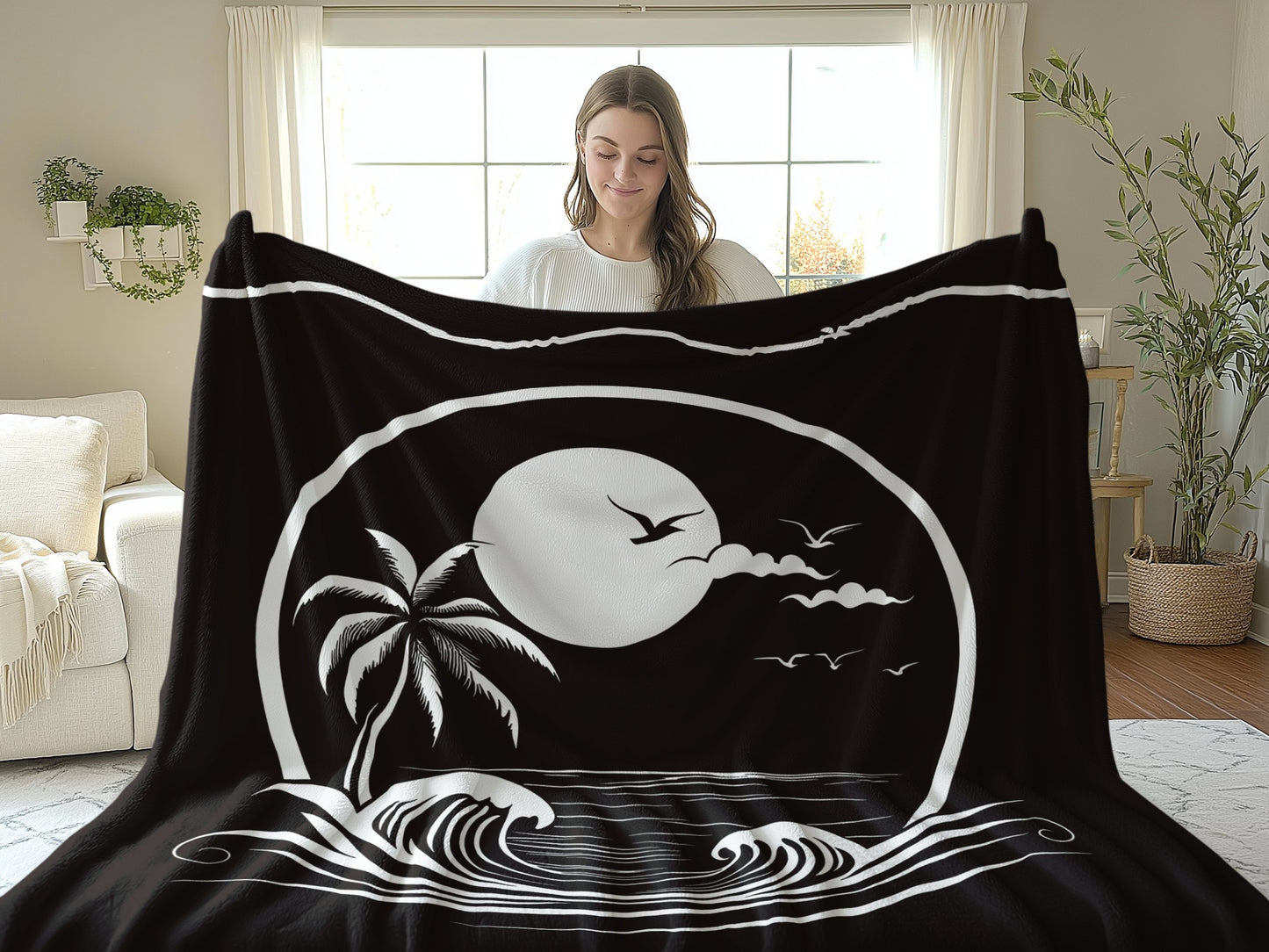 A woman holds the larger 60-inch Beachside Paradise Arctic fleece blanket, showcasing the stunning coastal scene.