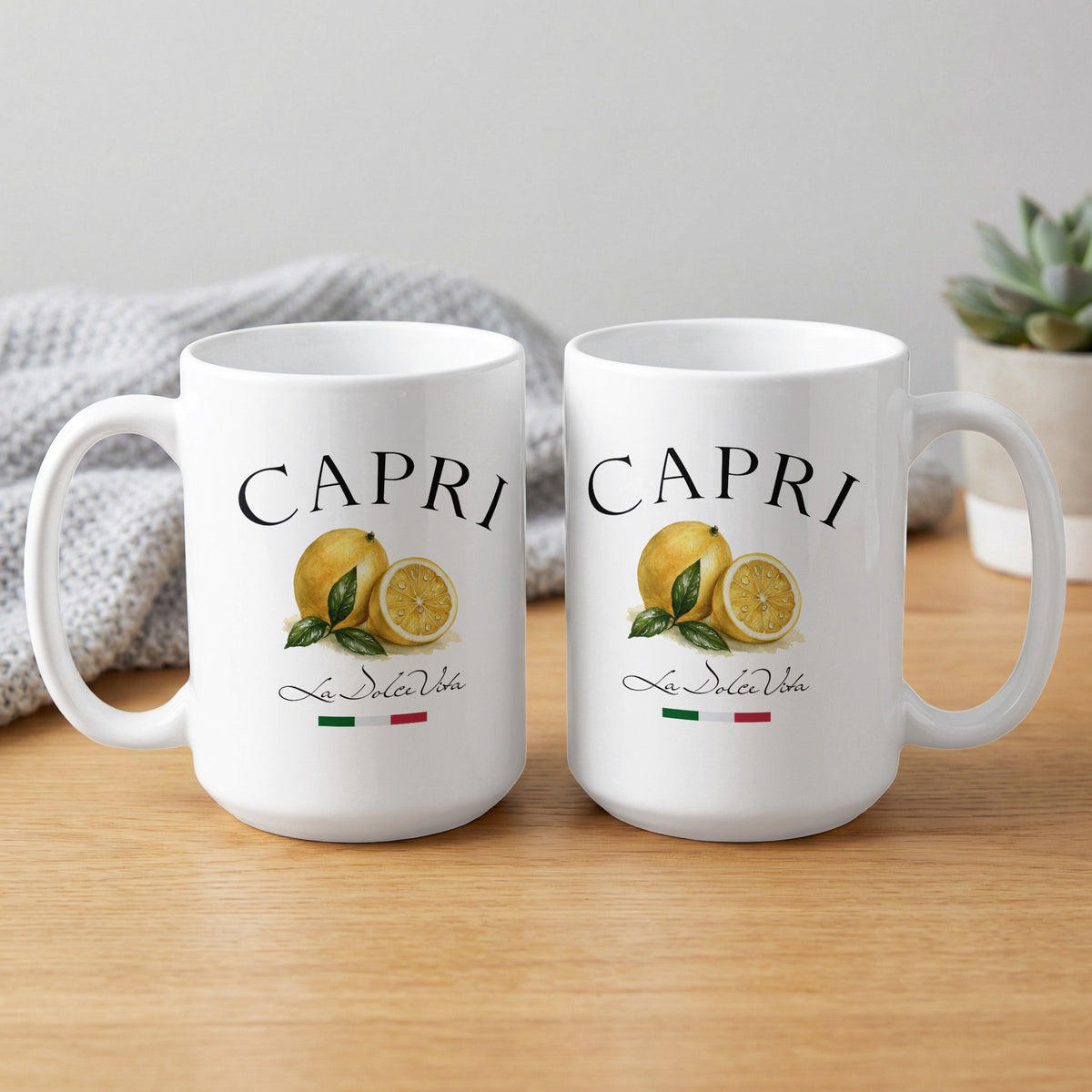 Front and back views of two Capri 15oz white ceramic mugs displaying the lemon and La Dolce Vita artwork.