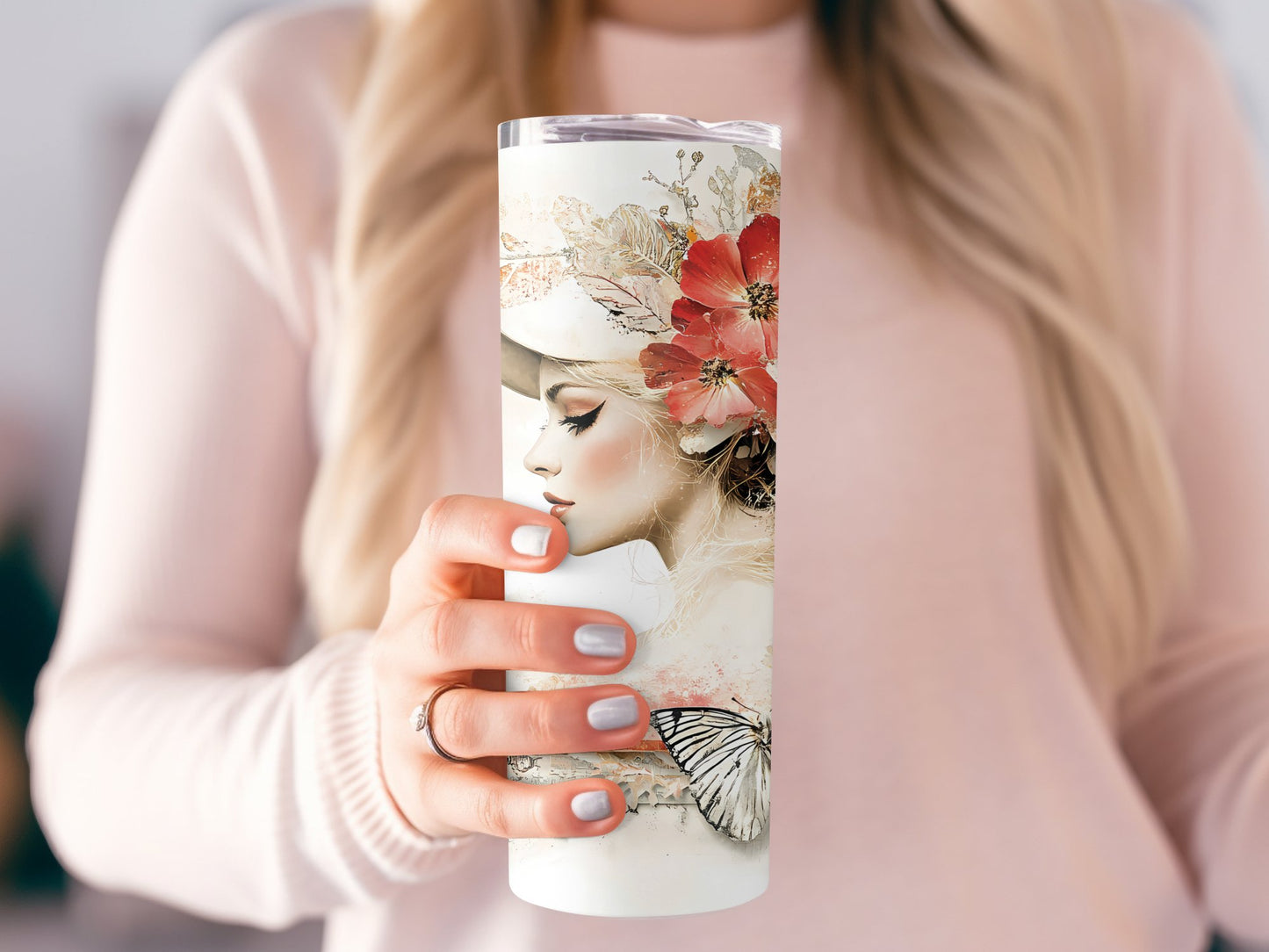 Model holding classic woman tumbler, slim 20oz stainless steel with antique-inspired artwork