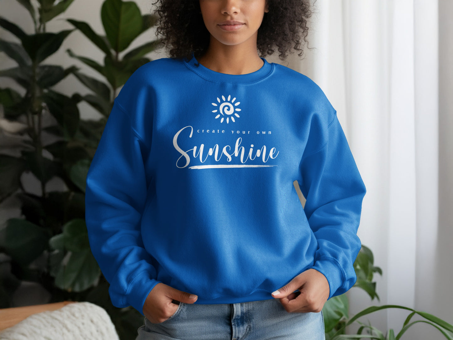 Royal blue unisex pullover sweatshirt with Create Your Own Sunshine slogan, classic crew neck and vibrant, uplifting design.