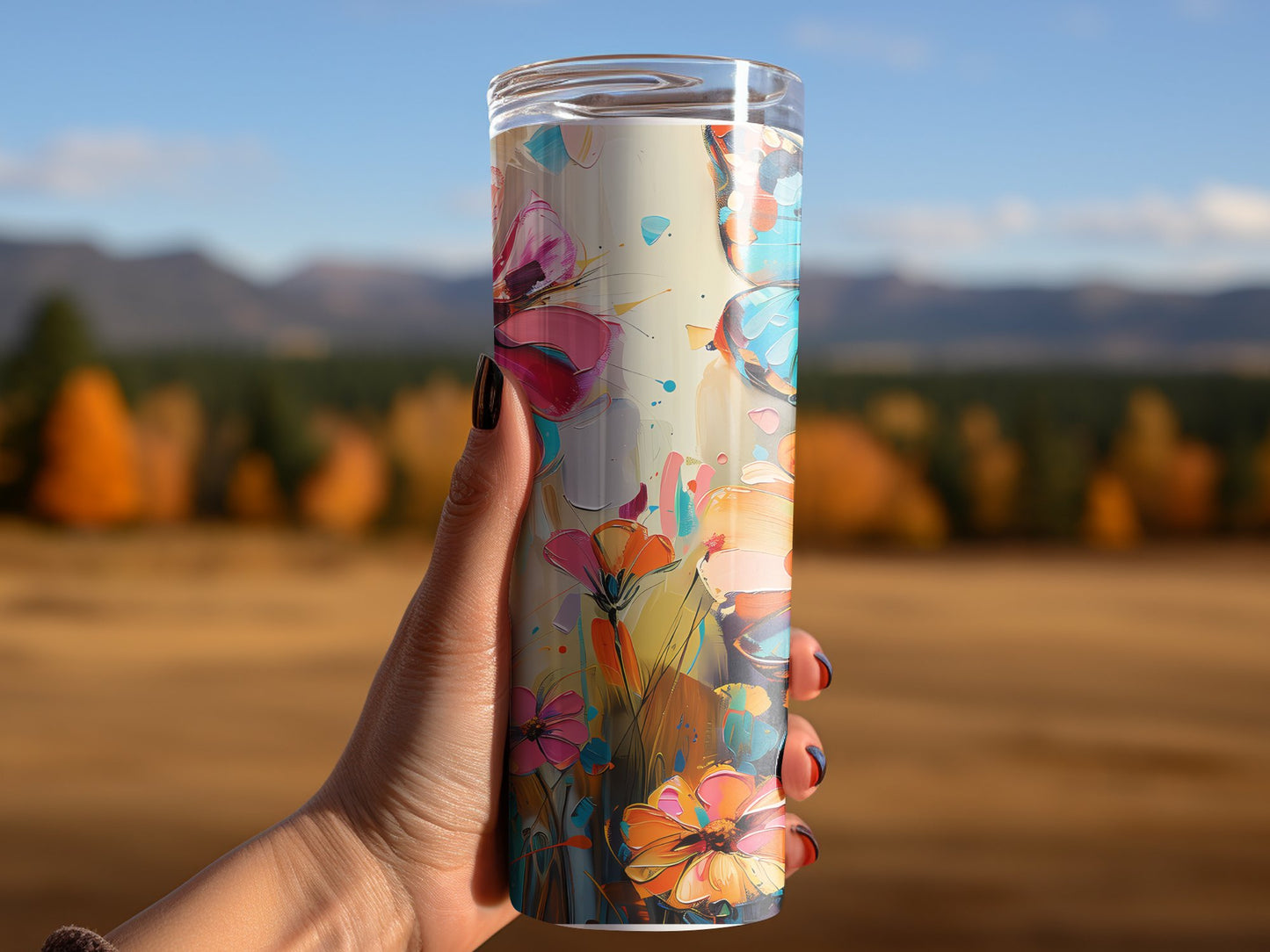 Woman using floral butterfly tumbler, featuring stylish floral and butterfly design with insulated stainless steel