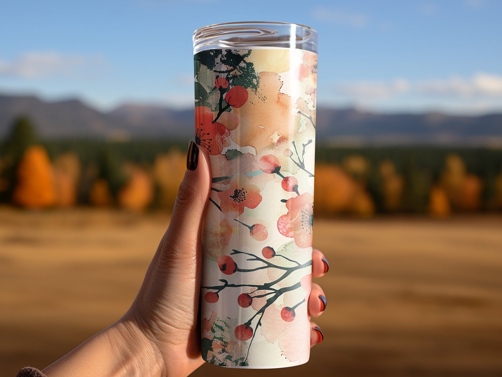 Woman using floral watercolour tumbler, insulated 20oz stainless steel with beautiful vibrant floral design