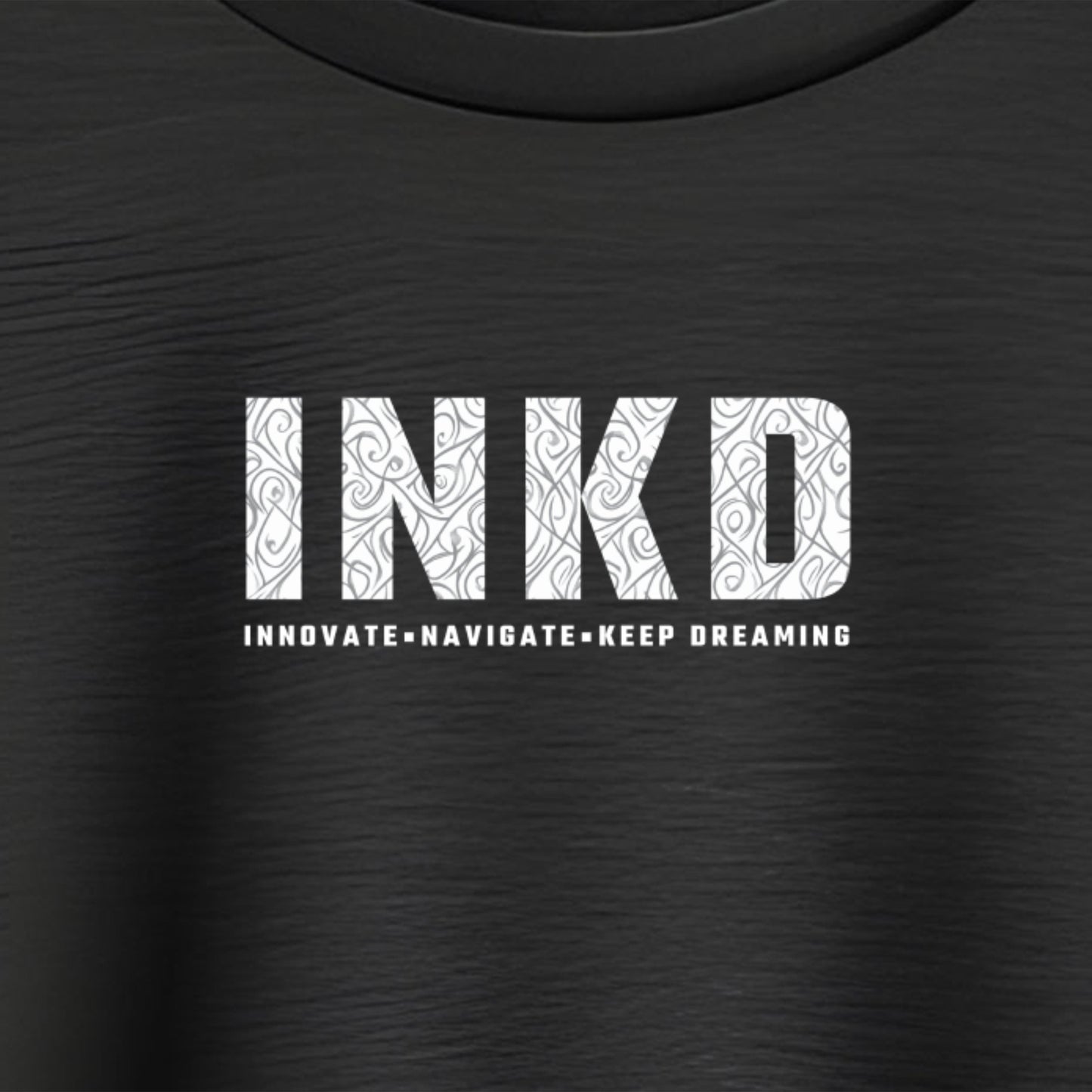 INKD T-Shirt Logo close up, stylish crew neck short sleeve unisex tee offering affordable daily fashion.