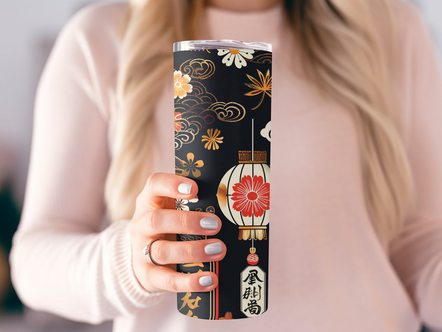 Model holding Japanese lantern tumbler, slim 20oz design with metal straw and delicate lantern artwork