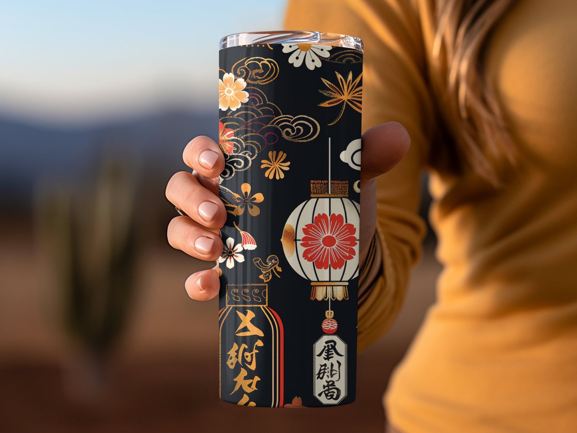 Japanese lantern tumbler in hand, 20oz stainless steel with intricate lantern print and secure clear lid