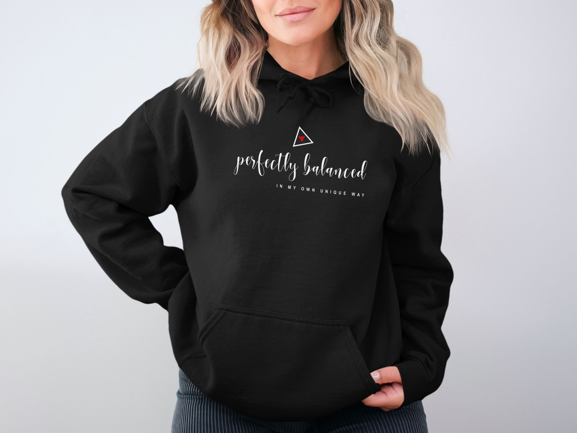 Black Perfectly Balanced fleece-lined hoodie with motivational minimalist print, front pocket, and relaxed unisex fit.