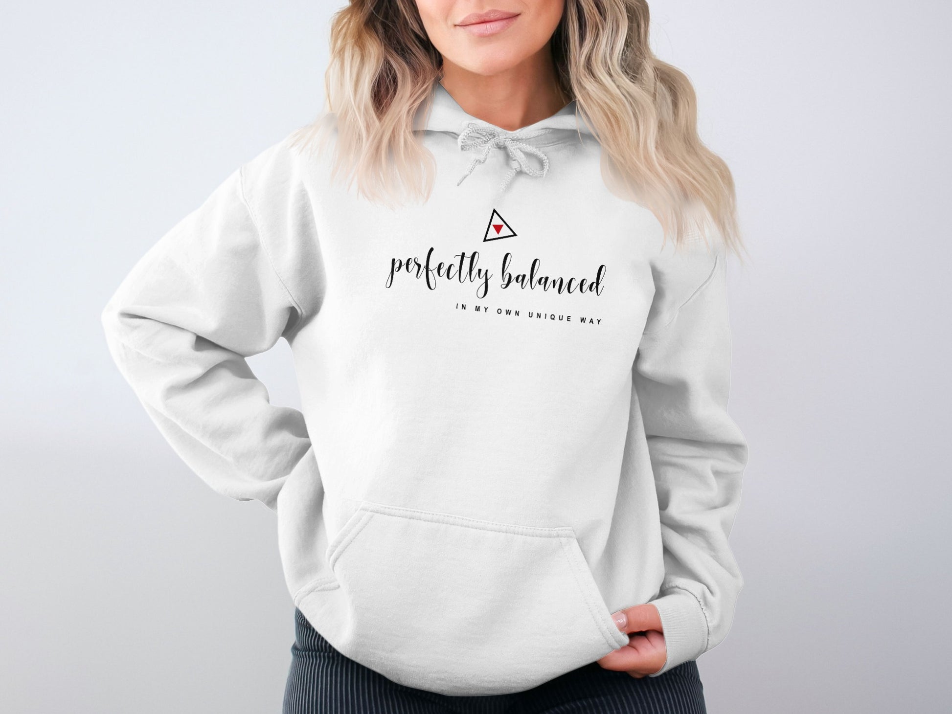 White Perfectly Balanced hoodie with clean black design, warm fleece core, and classic pullover unisex styling.