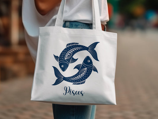 Pisces zodiac tote bag with dreamy fish design and large cotton body.