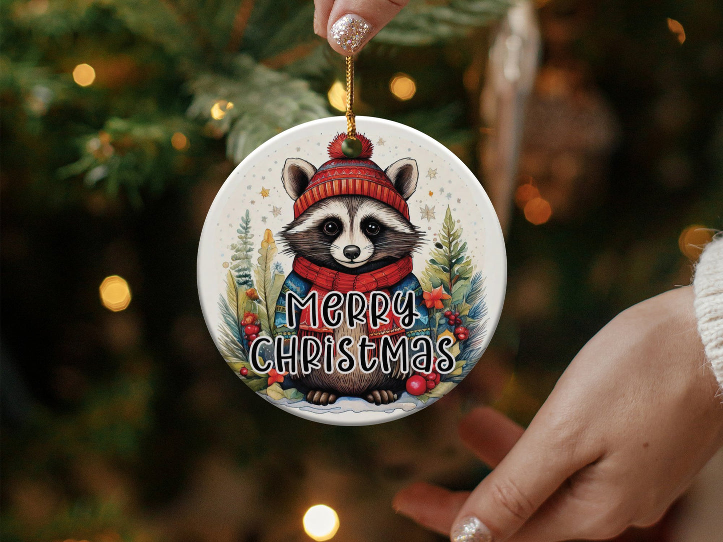3-inch ceramic ornament featuring a playful raccoon in a wintery scene, great for festive trees