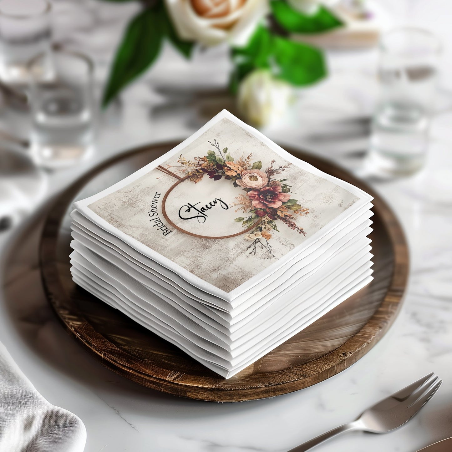 Bridal shower napkins with a rustic wreath design, adding warmth to your wedding-themed party.