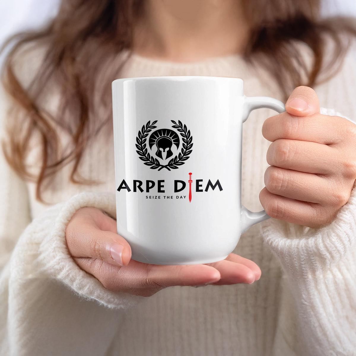 15oz White ceramic Seize the Day coffee mug held in hand, showing the bold helmet emblem, laurel wreath and red gladius accent detailing.