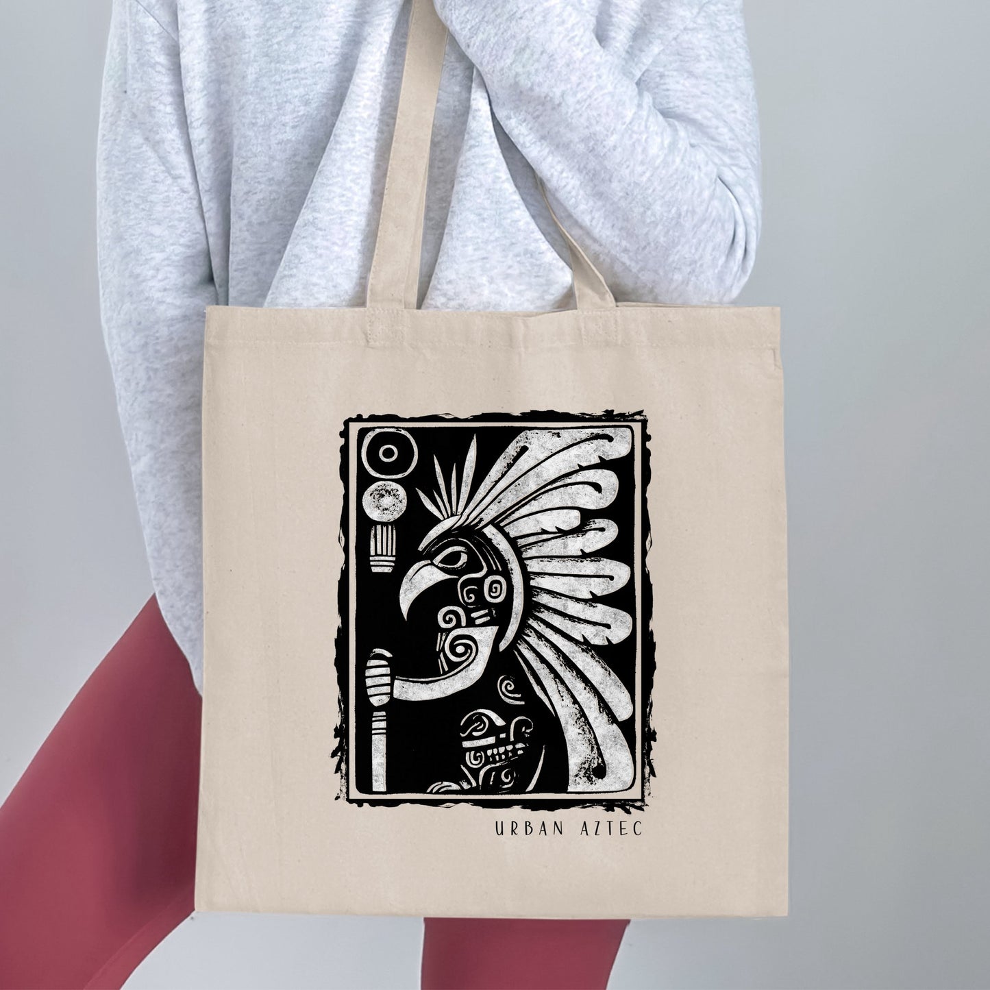 Urban Aztec Tote Bag Edition 2 showing a detailed warrior portrait framed by sweeping ceremonial feathers.