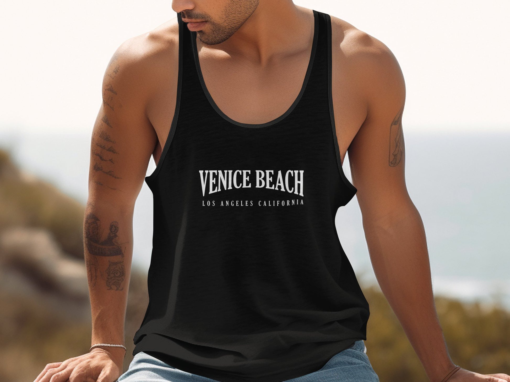 Black Venice Beach Tank Top in cotton, scoop neck and sleeveless cut, unisex fit with trendy coastal vibe.