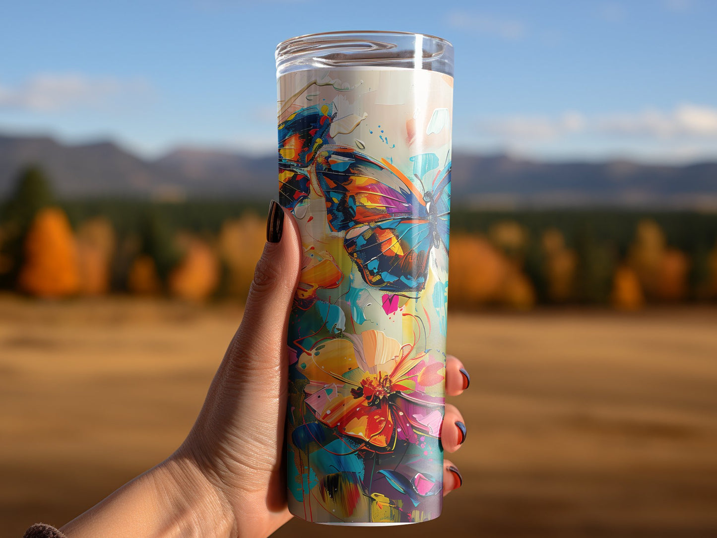 Woman using watercolour butterflies tumbler, insulated 20oz tumbler with graceful butterfly patterns and sleek finish
