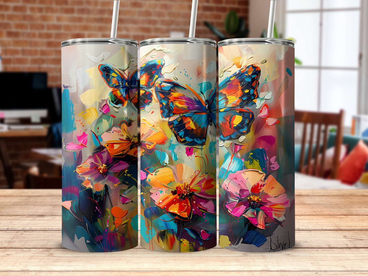 Watercolour butterflies tumbler on table, 20oz stainless steel with soft butterfly illustrations for a serene vibe