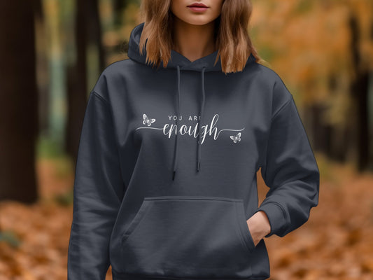 You Are Enough Hoodie with a classic fit, cotton blend fabric, and adjustable draw cord for a relaxed casual style.