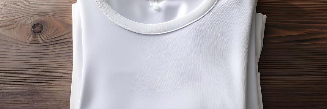 Folded white ribbed t-shirt on a dark timber surface showing fabric texture and neckline detail.