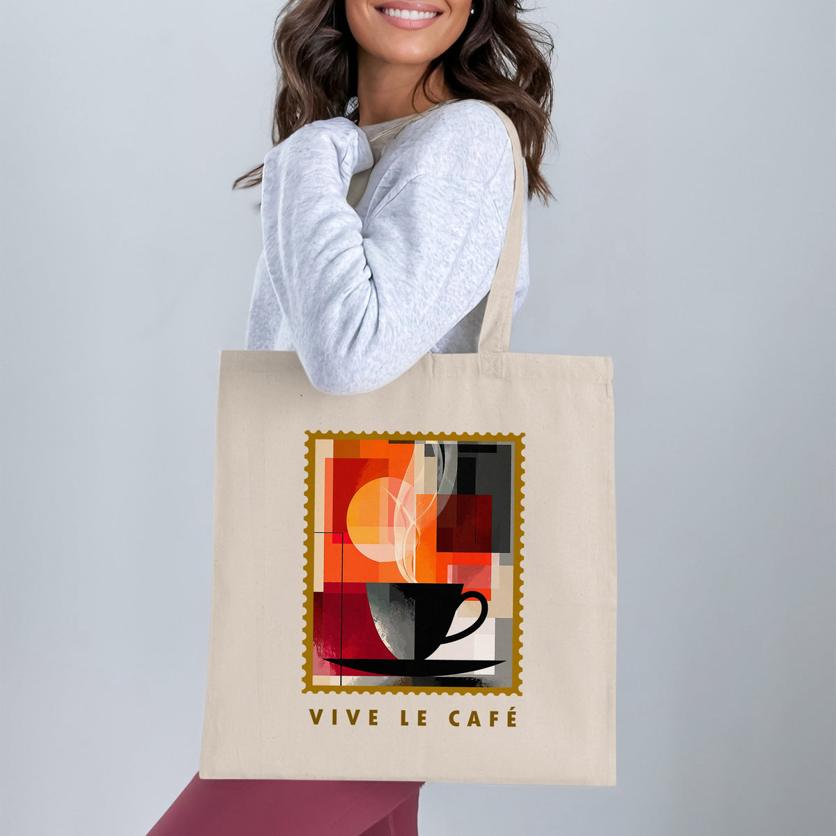 Abstract Coffee Blocks Tote Bag with black coffee cup, geometric colour blocks and golden circle worn over shoulder.