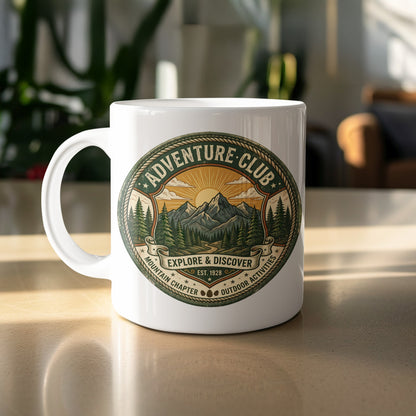 Adventure Club Explore & Discover 11oz ceramic mug featuring mountain trail, pine forest and vintage badge design.