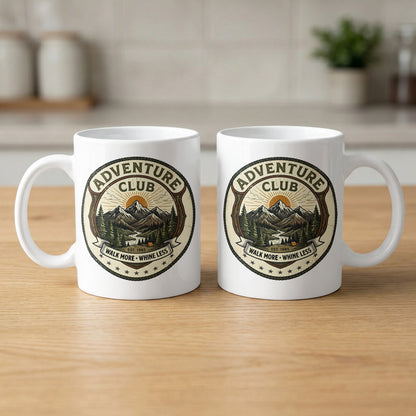Pair of 11oz Adventure Club mugs arranged to show the identical green wilderness badge design printed on both sides.