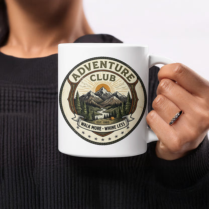 White 11oz ceramic mug displaying the Walk More Whine Less mountain trail and camping tent circular badge art.
