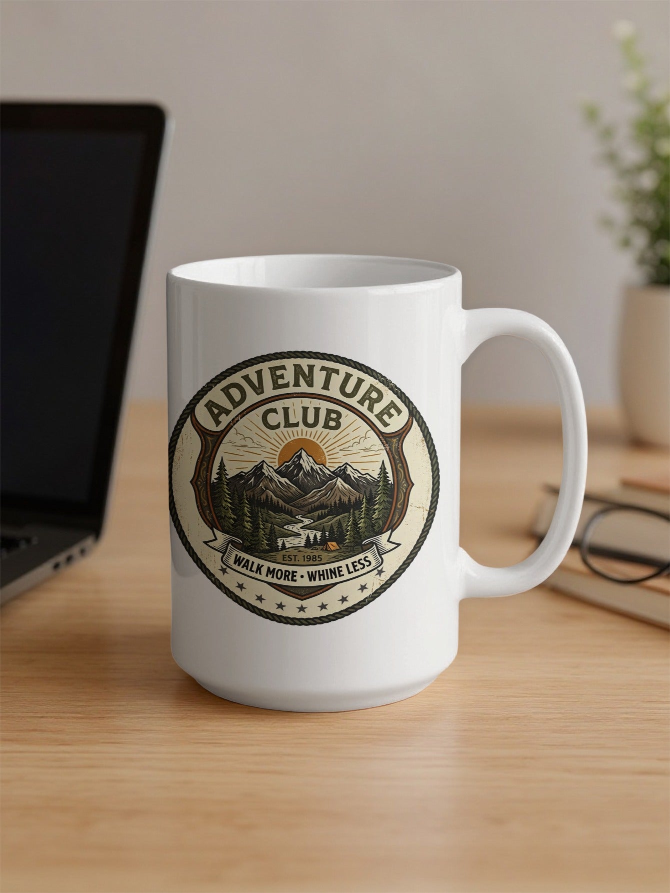 15oz white ceramic mug showcasing the Walk More Whine Less outdoor motto and twin-peaked mountain artwork.