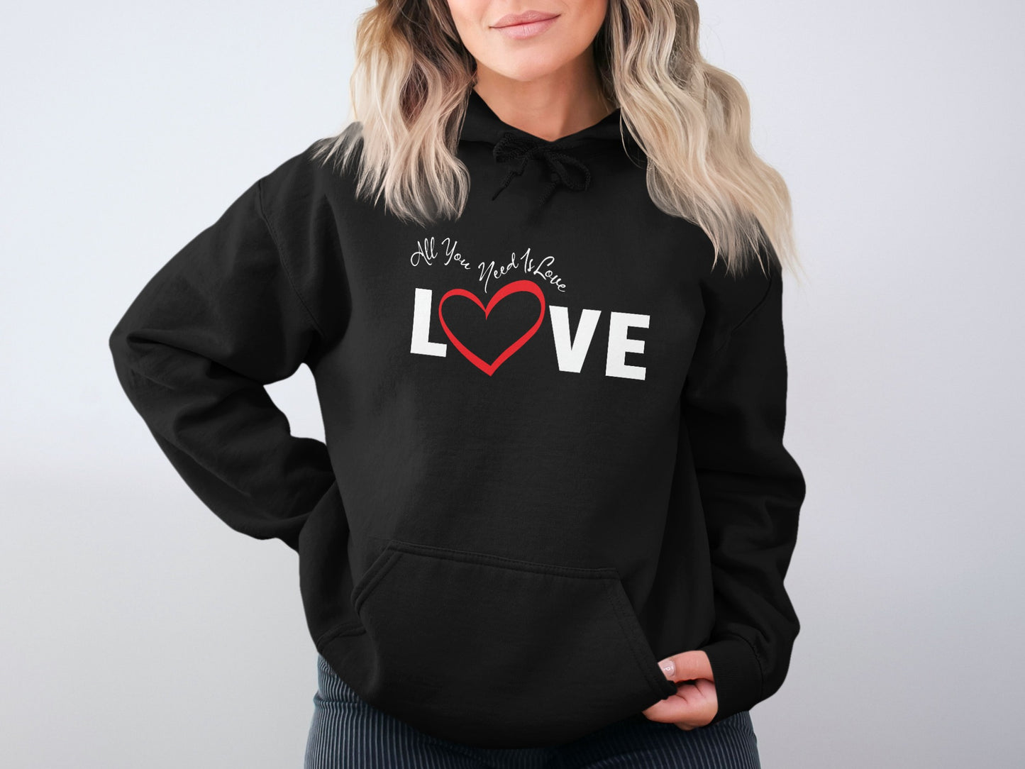 All You Need Is Love hoodie in black, unisex pullover with comfy fit, cozy cotton-blend fabric, and inspirational message with casual style.