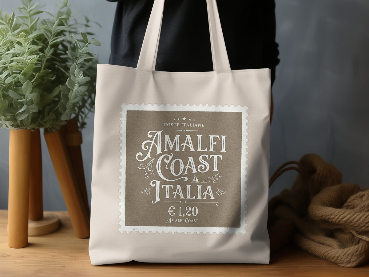 Amalfi Coast Italia Tote Bag in a lifestyle setting, highlighting its refined Italian-inspired vintage typography and natural canvas.