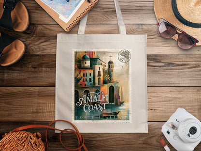 Canvas Amalfi Coast Postage Stamp Tote Bag featuring Italian coastal architecture, calm harbour water and AMALFI COAST white lettering.