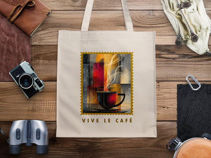 Amber Steam canvas tote bag with charcoal cup and saucer, golden disc, cream steam trails and gold serrated stamp border.