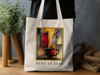 Amber Steam Tote Bag with golden disc, charcoal cup, structured vertical panels and distressed gold stamp border.