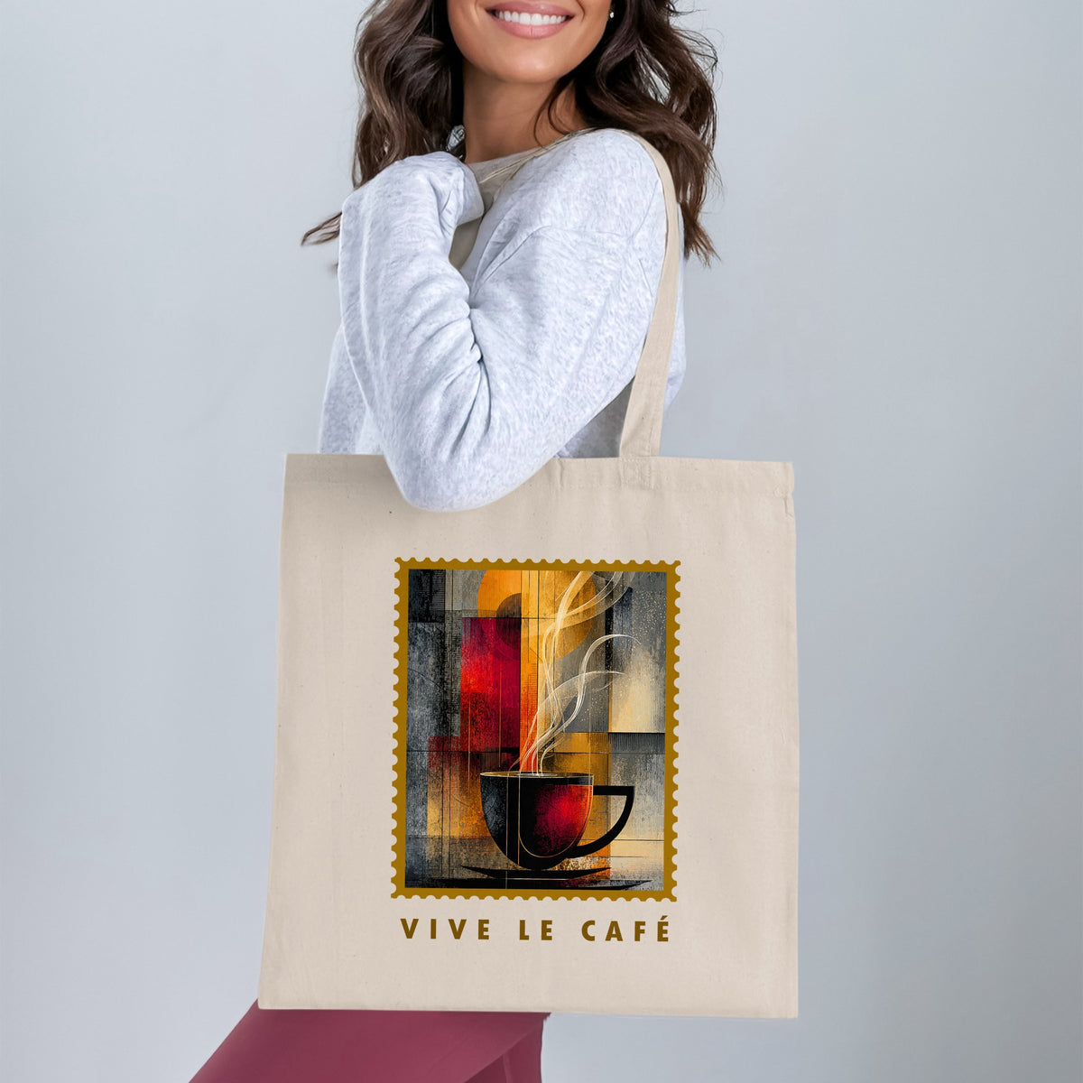 Amber Steam Tote Bag with charcoal coffee cup, golden disc and flowing cream steam worn over shoulder.