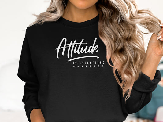 Black Attitude is Everything sweatshirt with bold white lettering, crew neck, unisex fit and soft cotton-blend fleece.