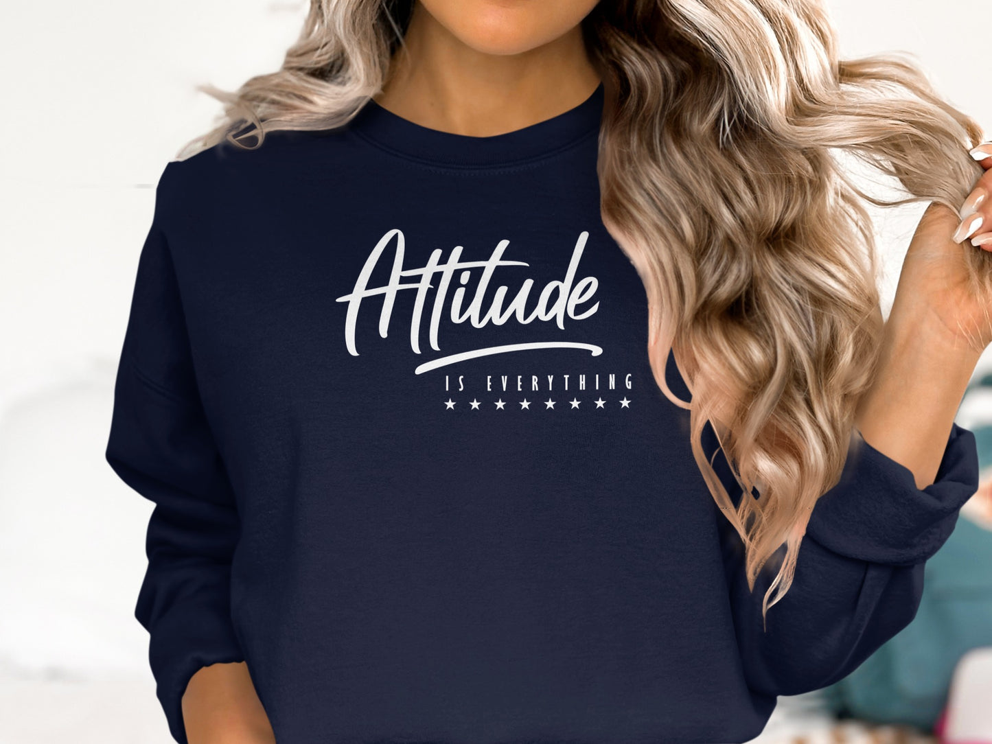 Navy blue motivational sweatshirt with Attitude is Everything message, relaxed unisex style and cozy cotton blend fabric.
