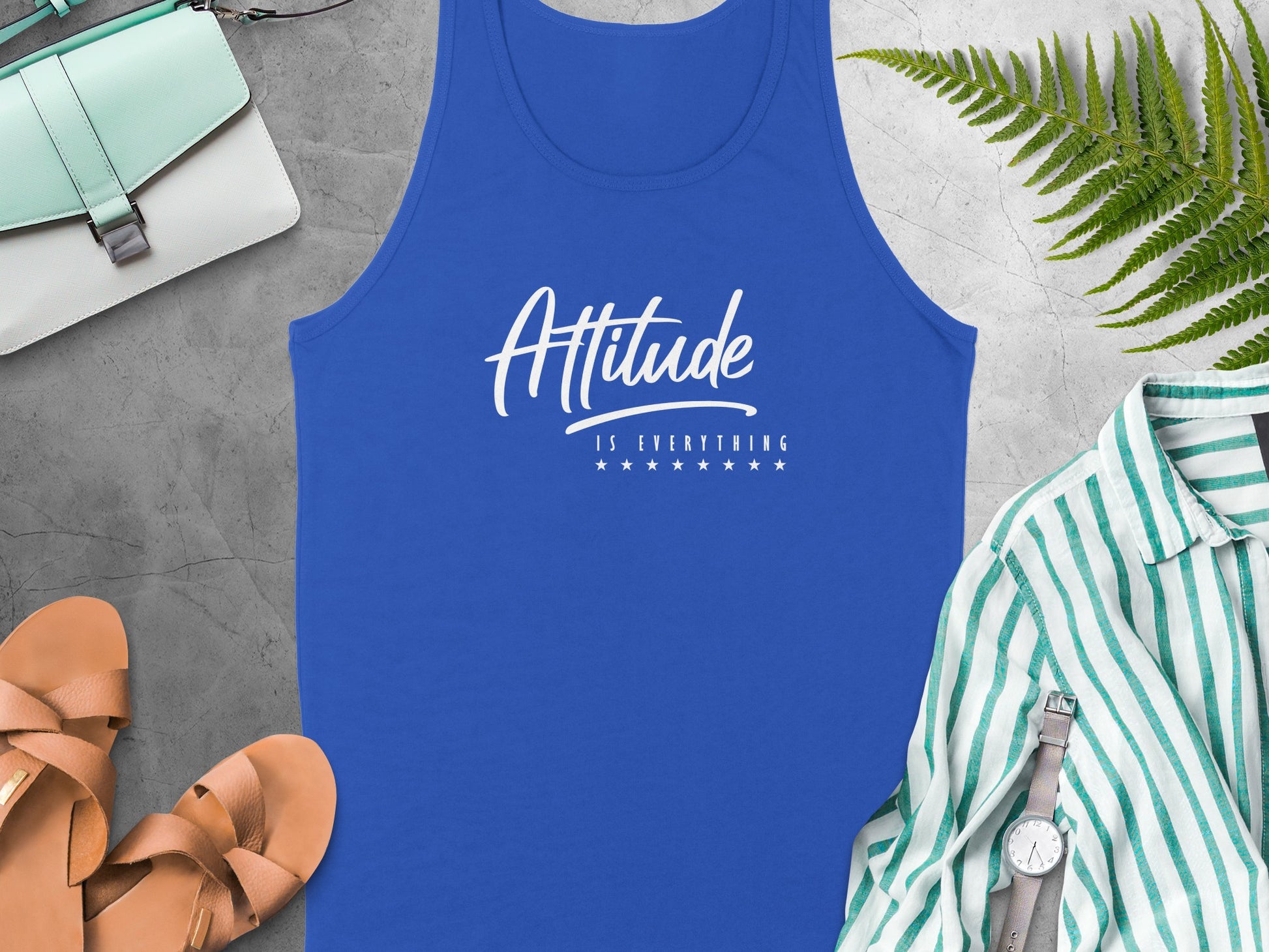 Attitude Is Everything tank top in true royal blue showcasing a confident motivational quote and modern fit.