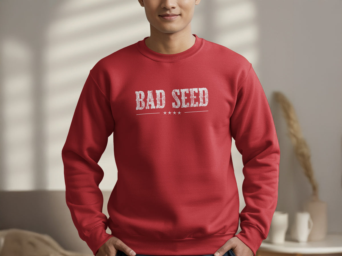 Red Bad Seed Sweatshirt highlighting the white distressed typography, fine divider line and four small stars in a vintage emblem layout.