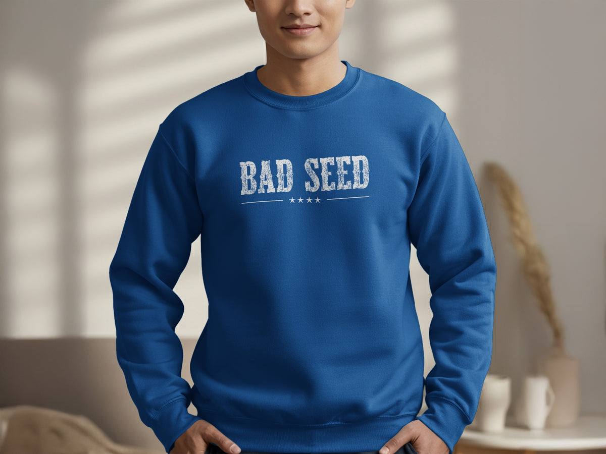 Royal Blue Bad Seed Sweatshirt displaying the full distressed BAD SEED chest graphic, with structured serif lettering and four stars below.