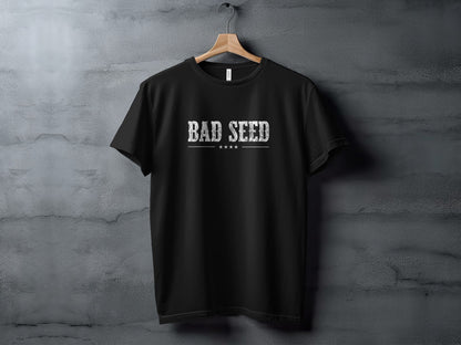 Black Bad Seed T-Shirt displaying bold distressed white serif lettering with four small stars and a fine horizontal line.