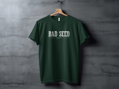 Forest Green Bad Seed T-Shirt featuring weathered white block serif text, a minimalist rule and four-point star row.