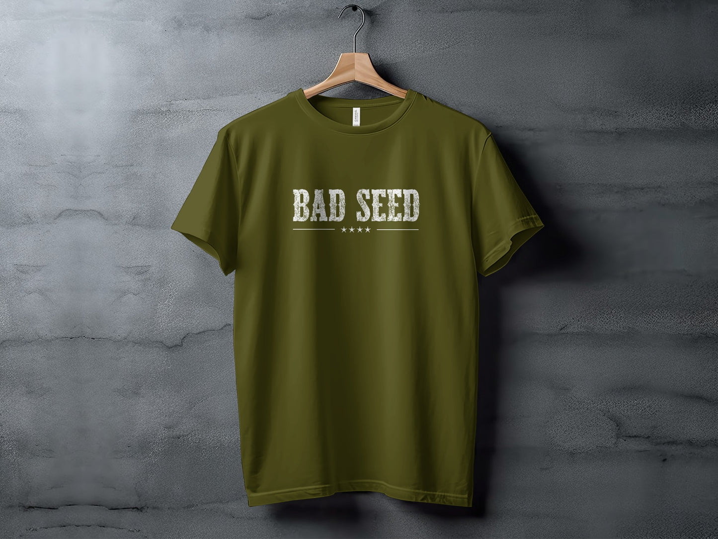 Olive Bad Seed T-Shirt featuring rugged vintage-style white lettering, fine horizontal rule and understated four-star motif.