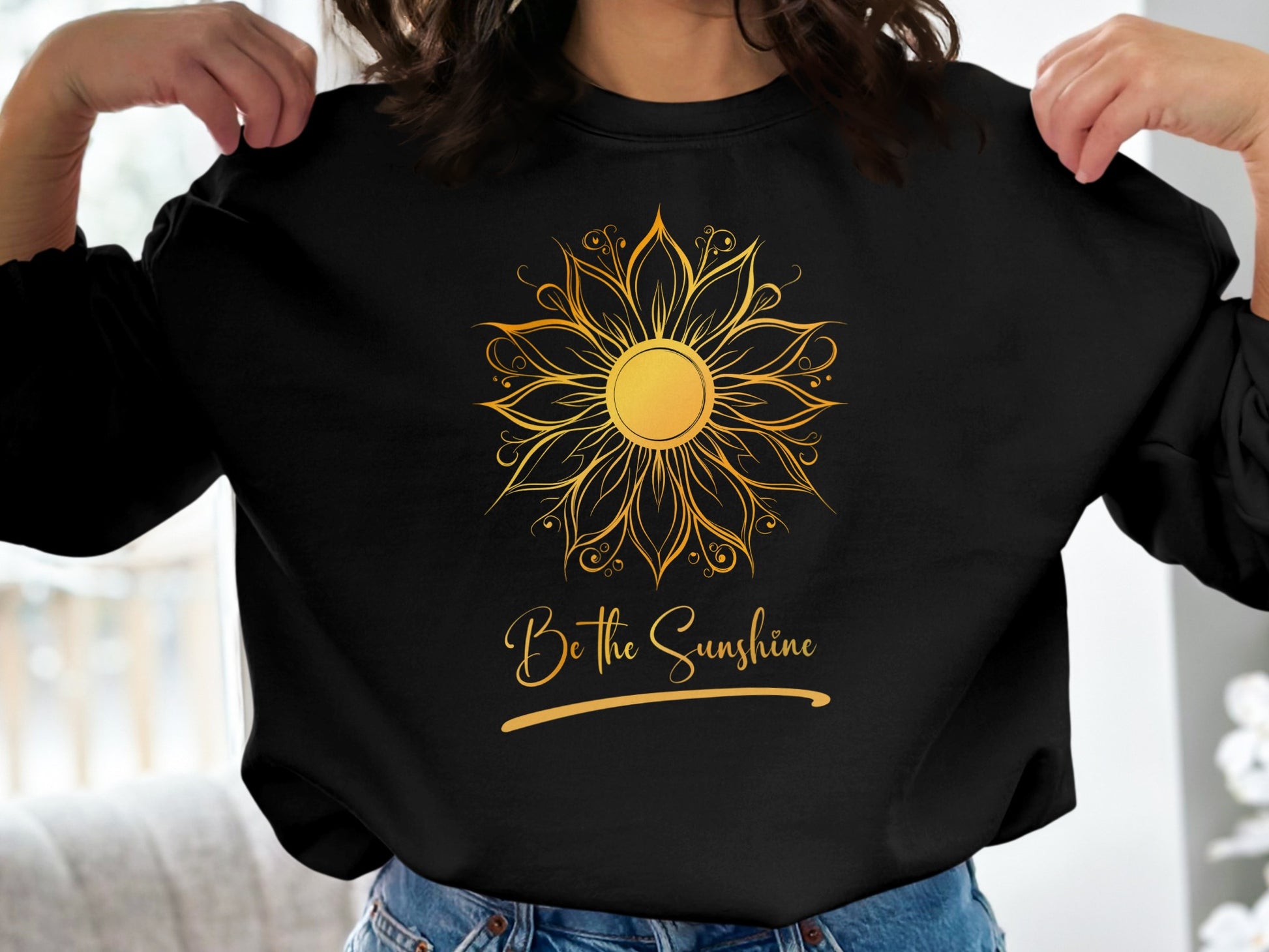 Soft black Be the Sunshine pullover sweatshirt with inspiring motivational text, cozy fit, and classic crewneck styling.