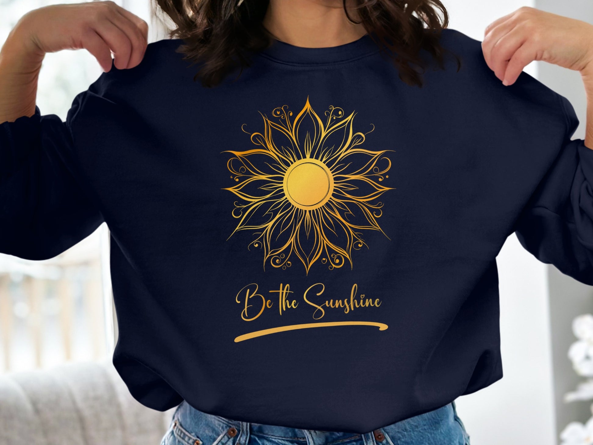 Navy pullover sweatshirt featuring Be the Sunshine slogan in bright print, relaxed casual crew neck cut for everyday wear.